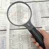 Vergrößerungsglas Carson Split Handle HF-11 — 3,5× Handlupe, schwarz/transparent, AAA-Batterie